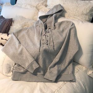 Grey hooded sweatshirt with cute crisscrossing tie